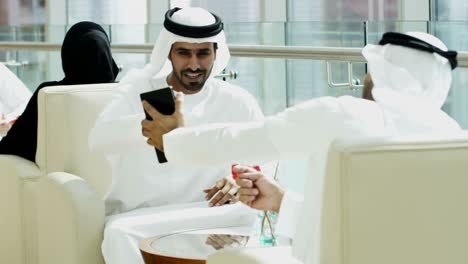 arabic business colleagues using touch screen wireless technology