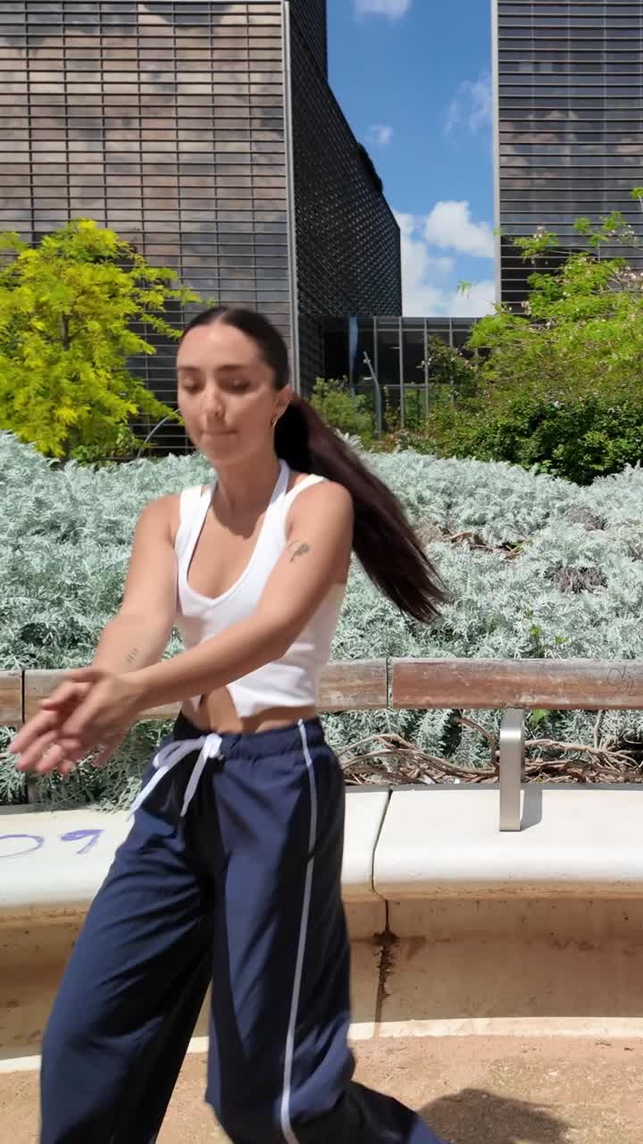 Woman dancing in an urban park