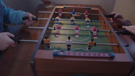 kids play table football at home