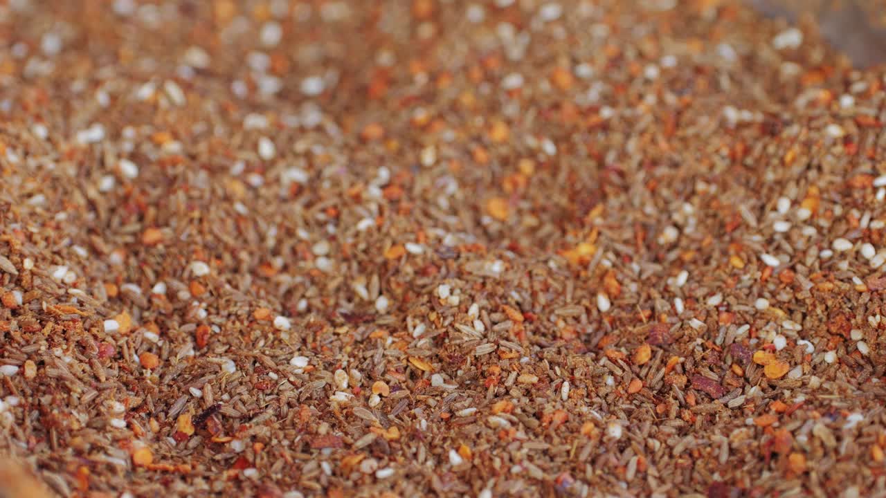 Mix spices dried pink, black pepper, green dill, red paprika, yellow turmeric, garlic, salt close-up macro. A bunch of natural spice for food .Seasonings and condiments concept