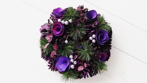 Christmas-Wreath-on-White-Wooden-Background