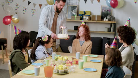 birthday girl blowing candles