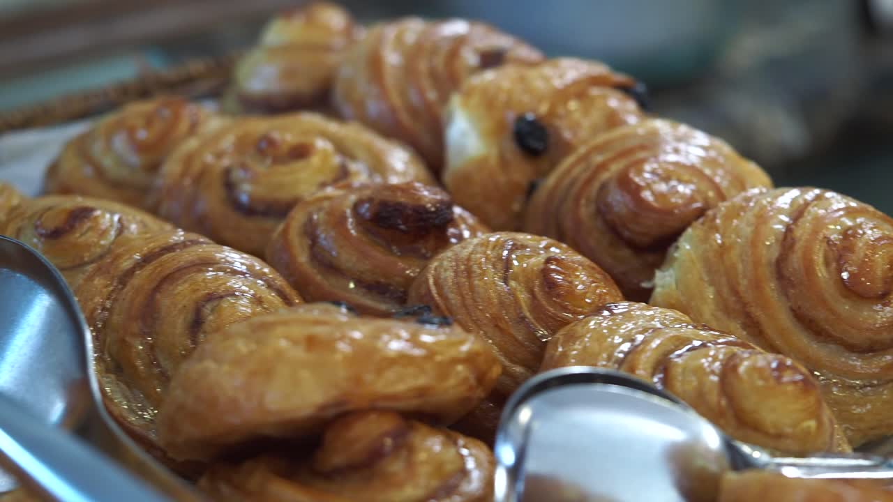 Assortment of Freshly Baked Glazed Pastries on Display