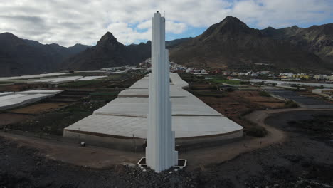 Tourists-Walking-Towards-The-Punta-Del-Hidalgo-Lighthouse,-Tenerife