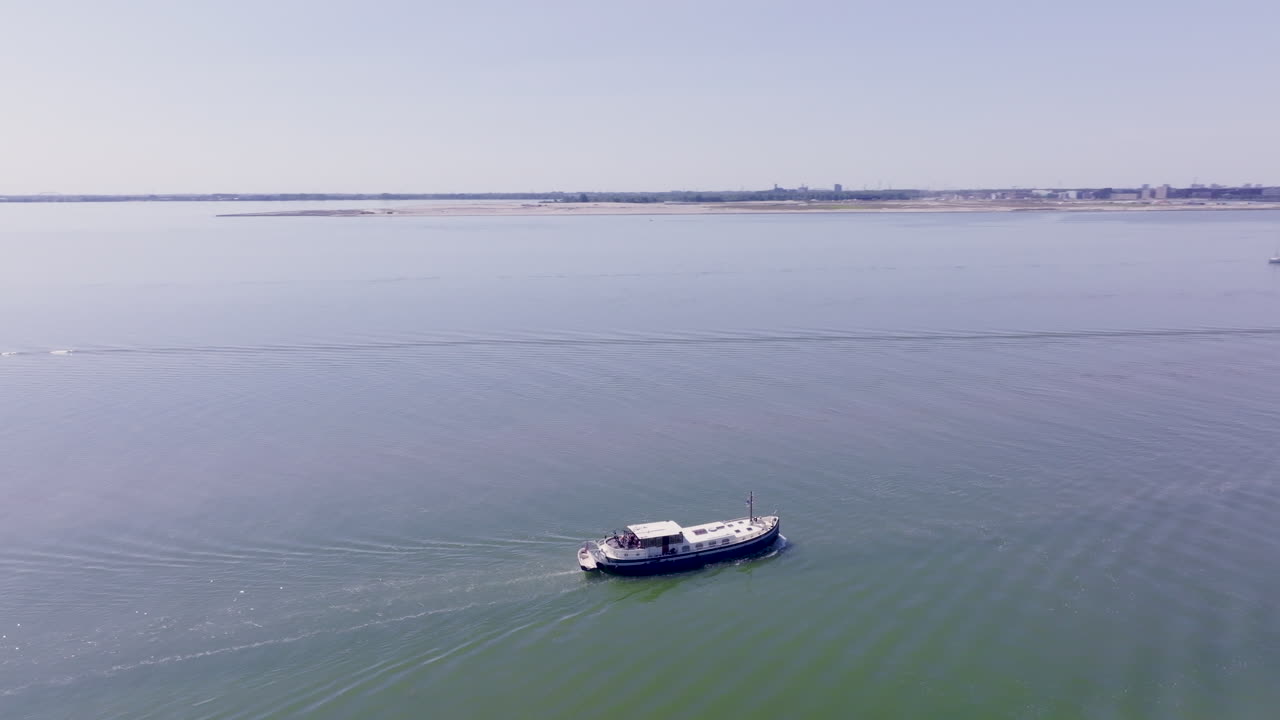 Breathtaking aerial view showcasing the beauty of Dutch waterways and classic boat design