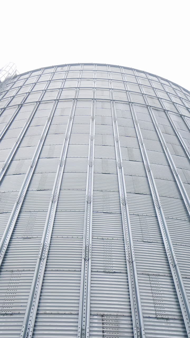 Huge steel elevator storage. Food industry agricultural tank