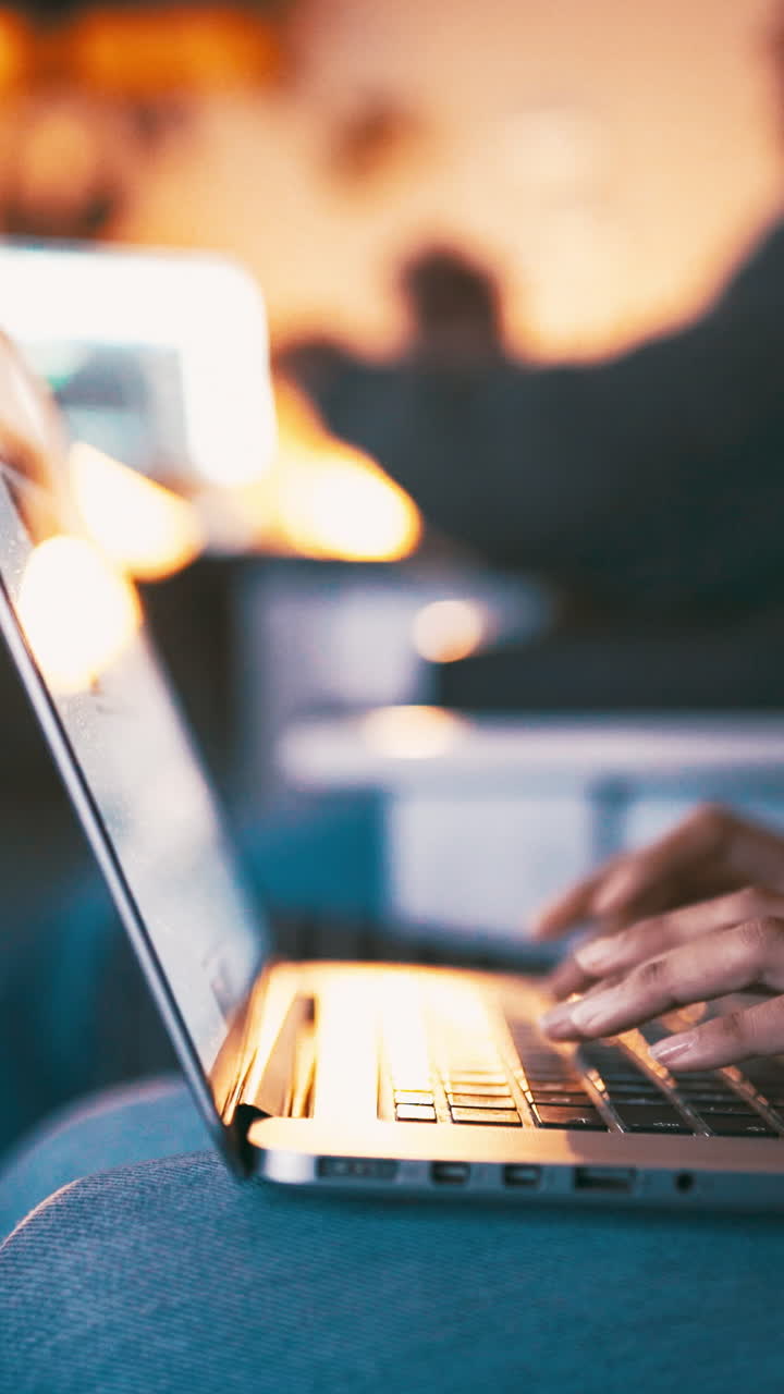 Close Up of Hands Typing on a Laptop Keyboard