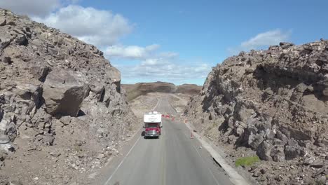 aerial push over road revealing erosion of road from flooding.
