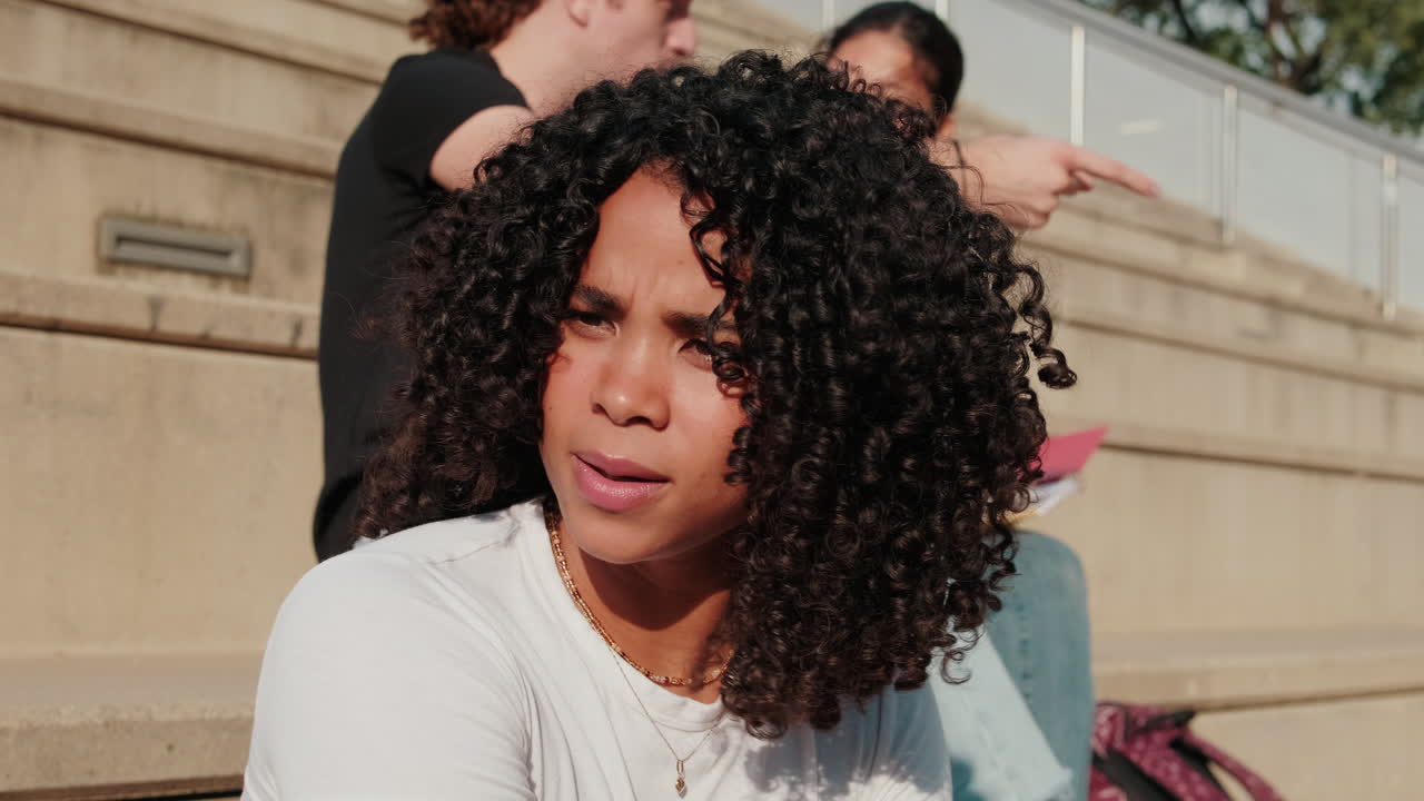 Multicultural friends having fun laughing out loud in city street. Close up of