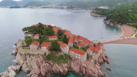 scenic aerial shot of sveti stefan coastal village montenegro featuring historic stone villas and ocean views