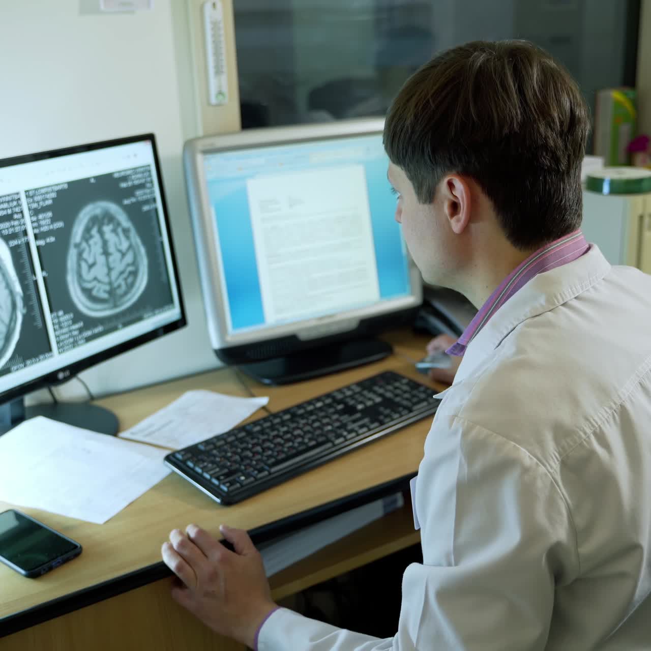 Doctor working at the hospital. Neurologist working on personal computer in modern laboratory