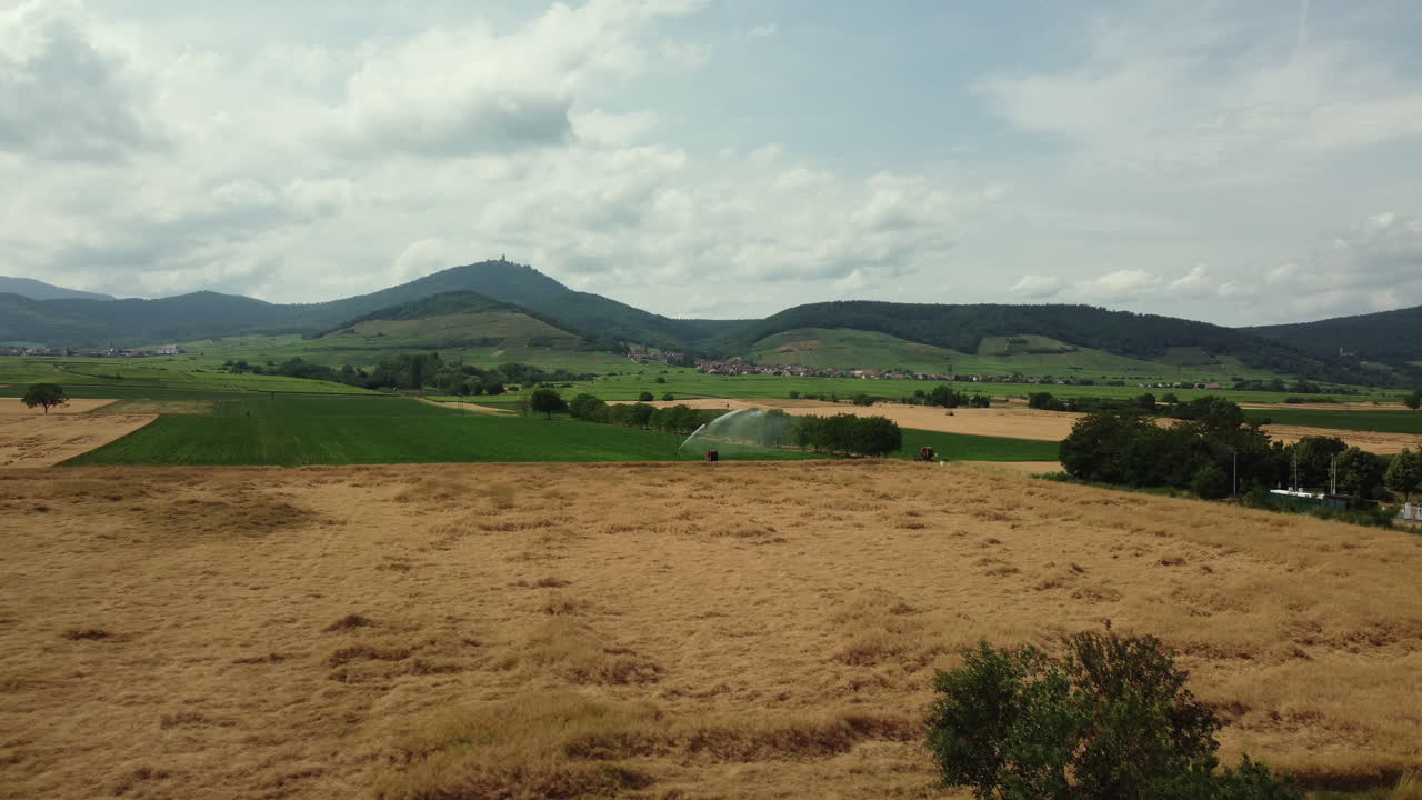 Aerial View of Agricultural Fields and Mountains