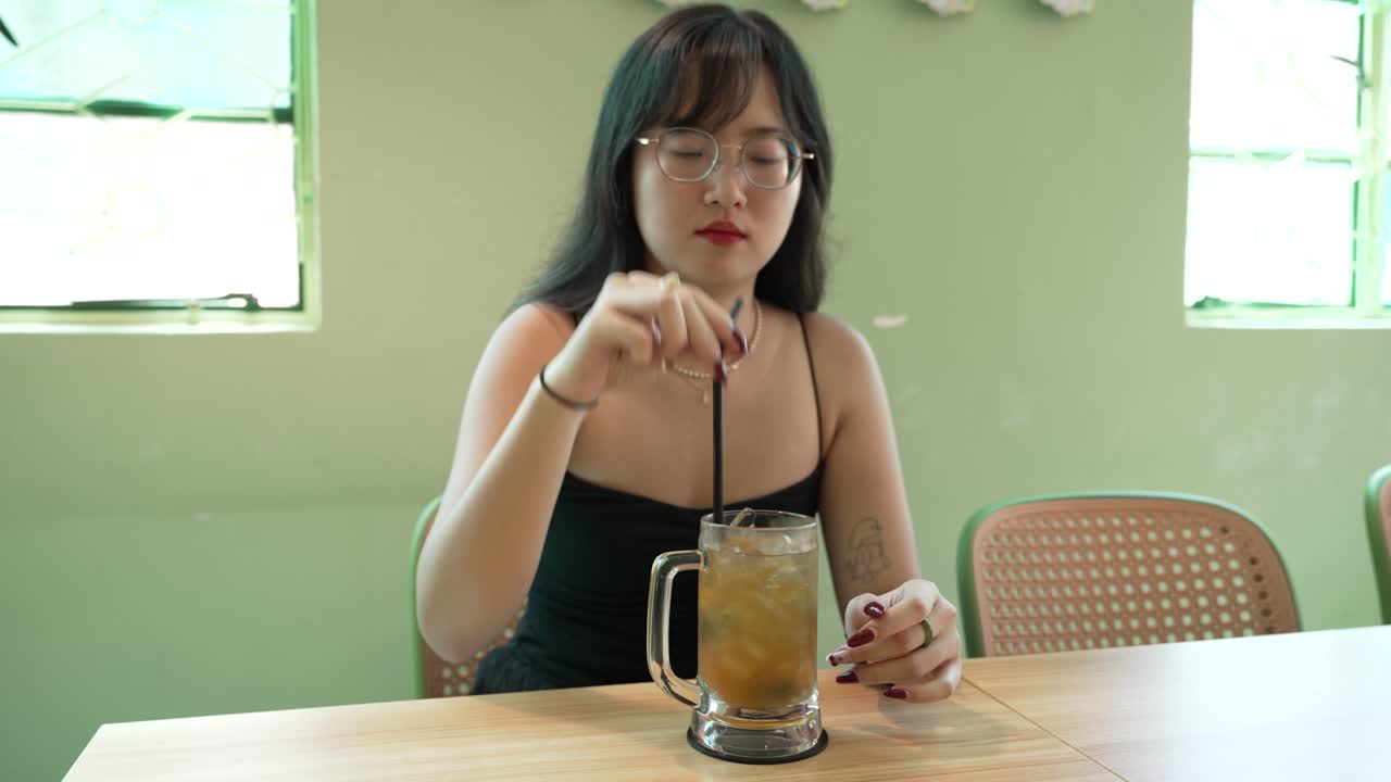 Flavoursome lemon iced tea beverage, refreshing drink, young female