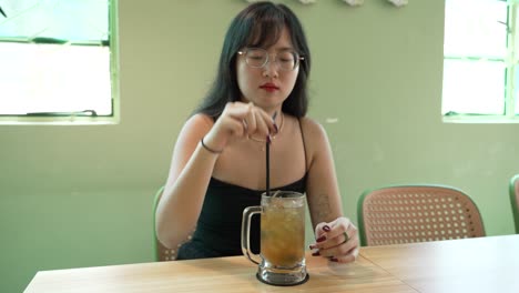 flavoursome lemon iced tea beverage, refreshing drink, young female