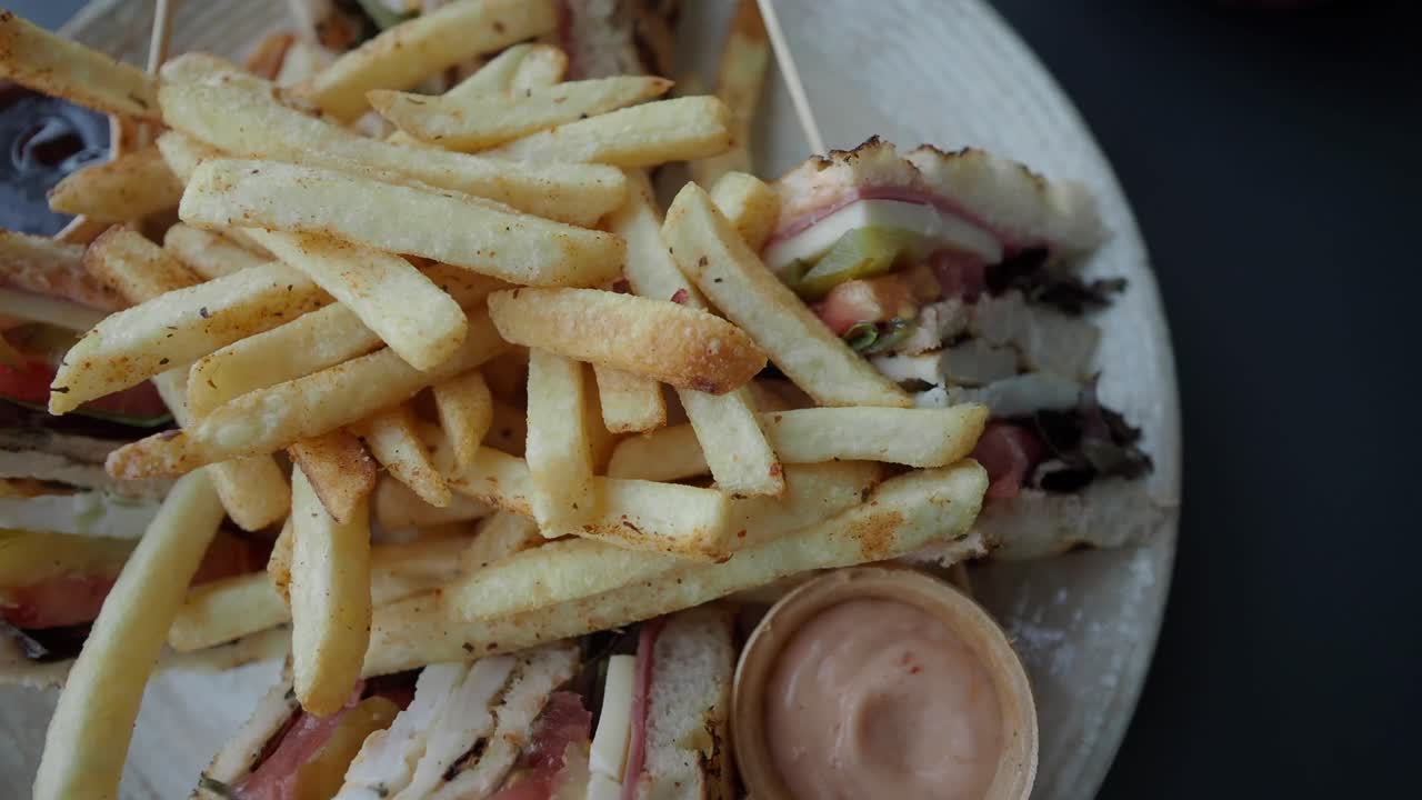 Club sandwich and fries