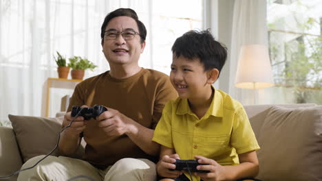 asian man and boy in the living room