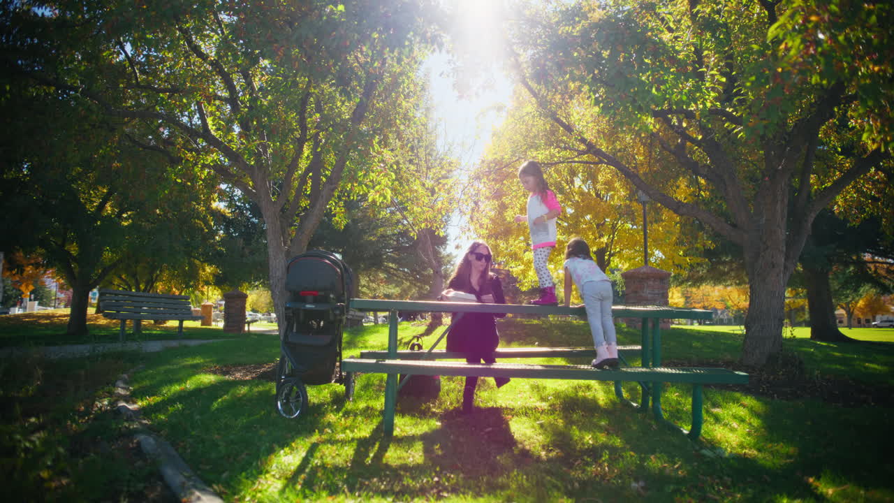 Mother and Daughters at a Park Picnic