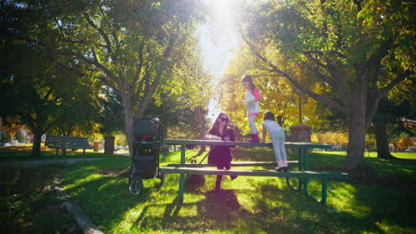 mother and daughters at a park picnic