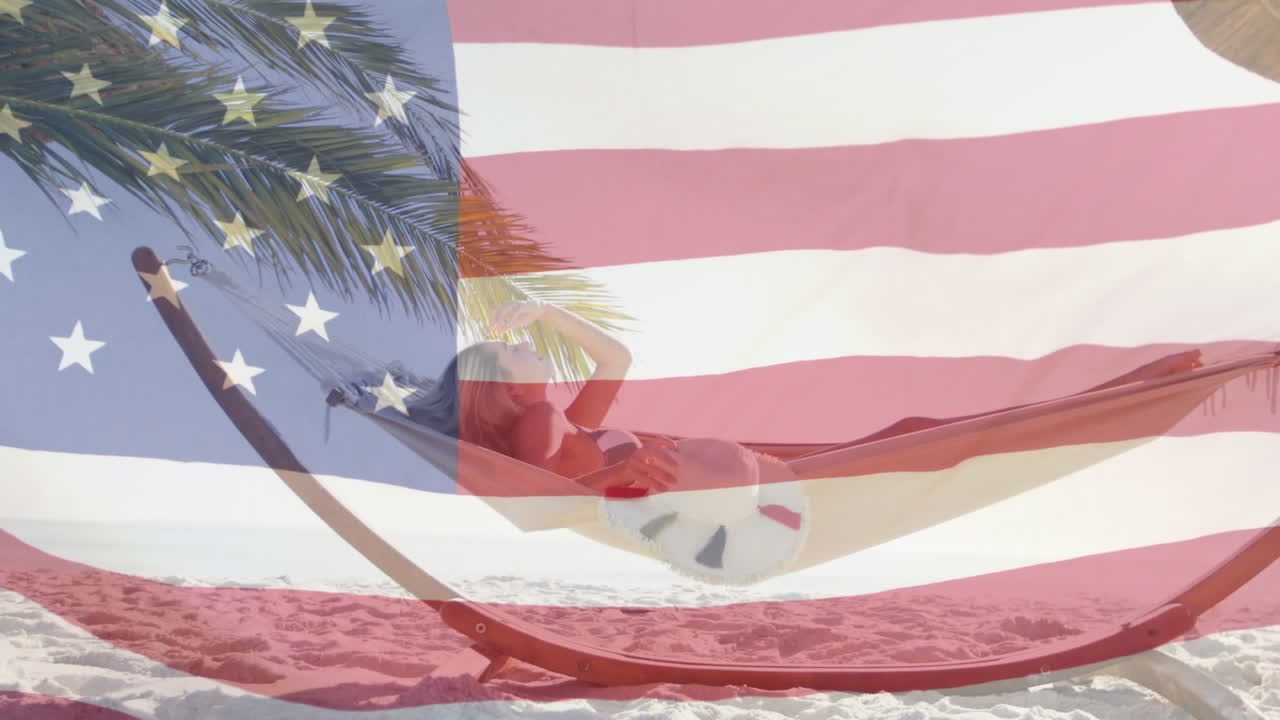 해변의 해마크에서 휴식을 취하는 여성 위에 흔들리는 미국 국기의 애니메이션