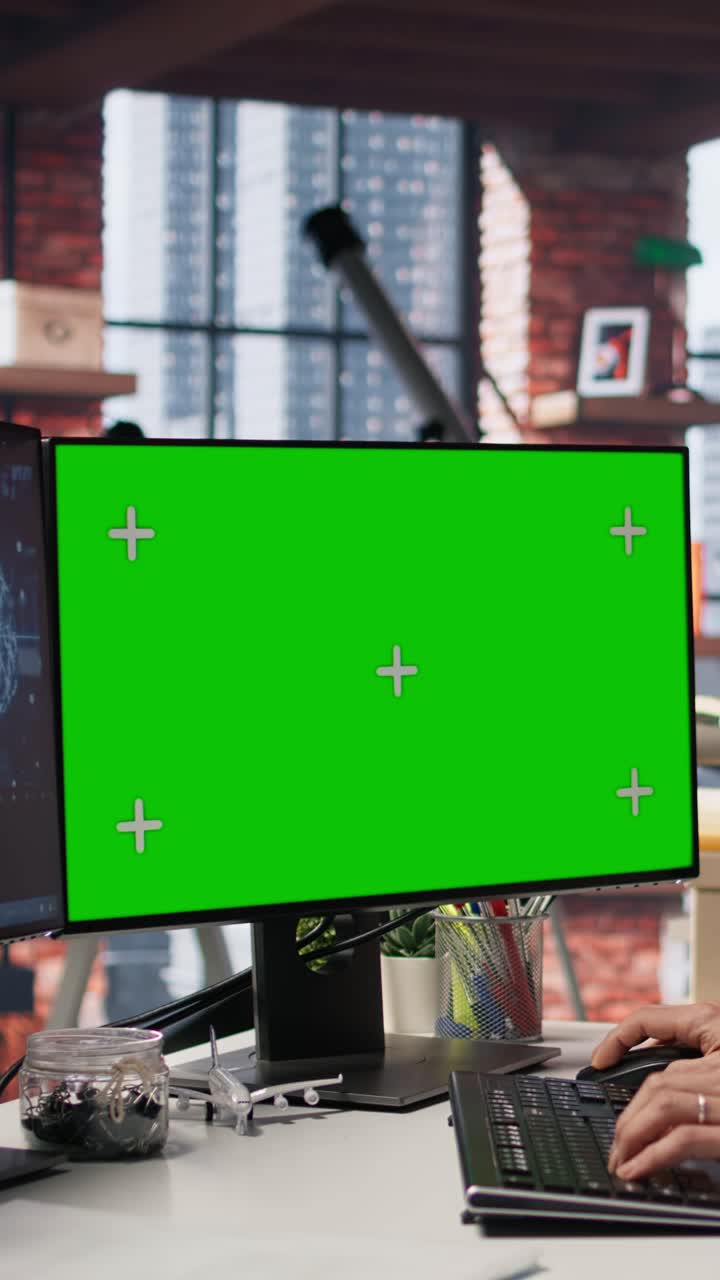 Vertical video AI startup office senior developer building application on green screen computer