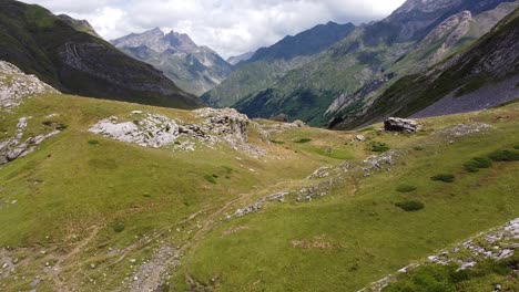 spanish pyrenees, spain - aerial drone view of green valley with rocky mountains