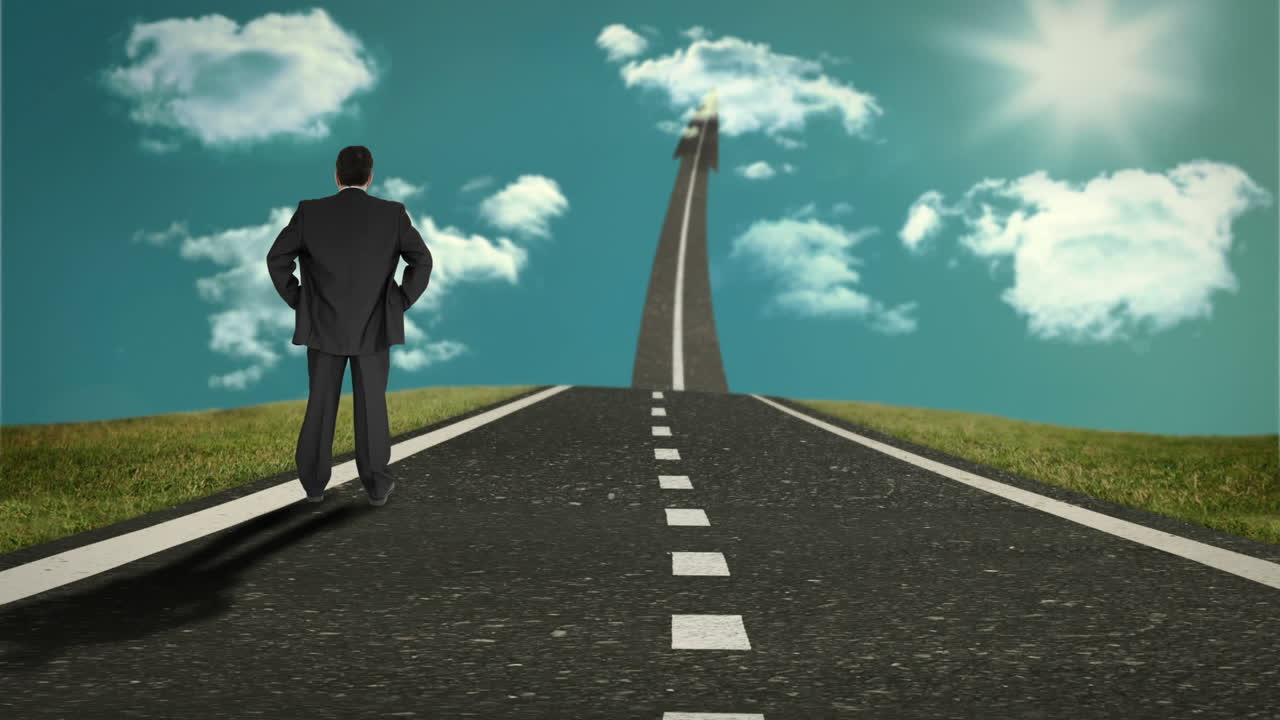 하늘을 가리키는 길에 서 있는 사업가