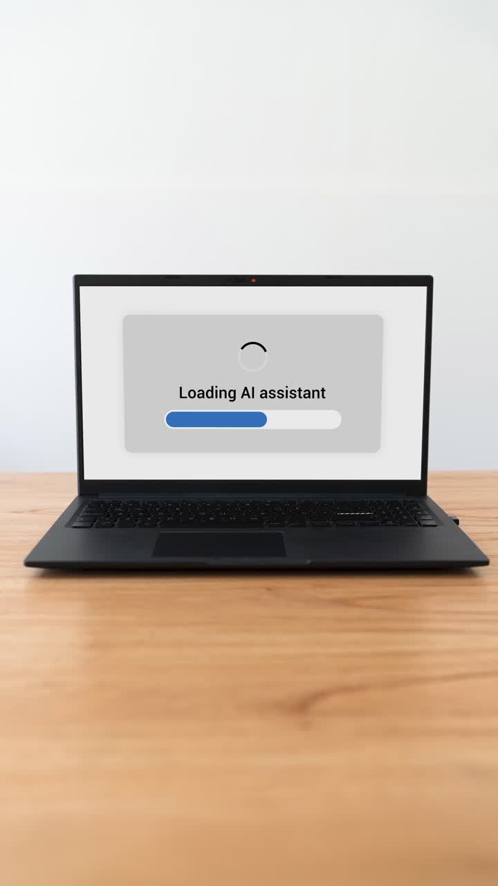 Vertical shot of a laptop loading AI assistant. Concept of using artificial intelligence for work.