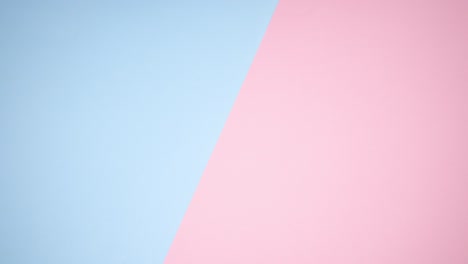 make up palettes and products appear from right to left on pastel background - stop motion