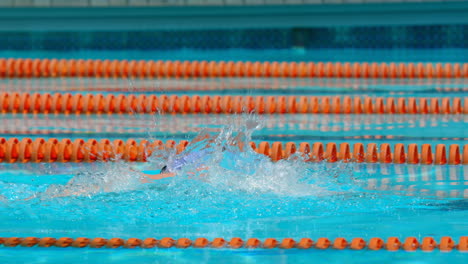 male swimmer swimming inside pool 4k