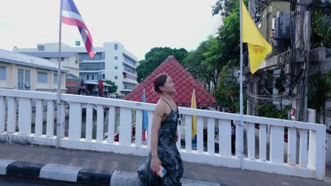 woman walking on a bridge in thailand