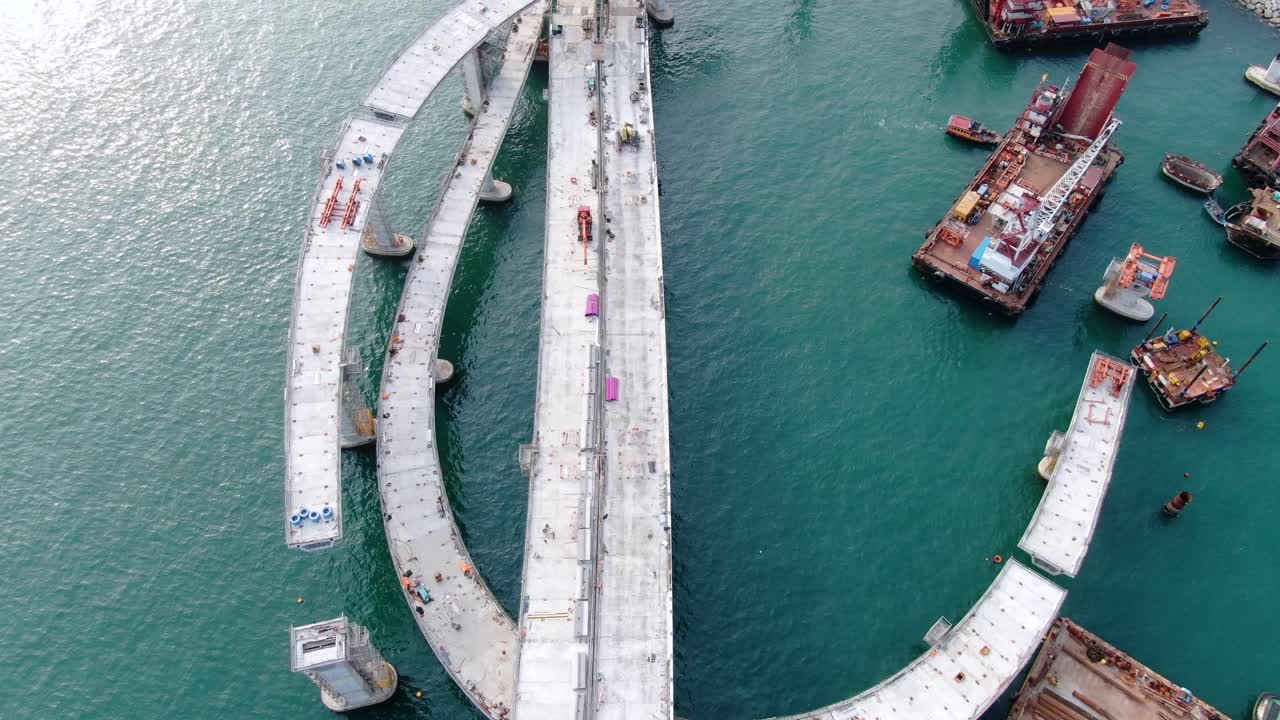 proyecto de construcción del enlace cruzado de la bahía de hong kong, un puente doble de dos carriles que conecta el túnel tseung kwan o lam tin con la carretera wan po, vista aérea