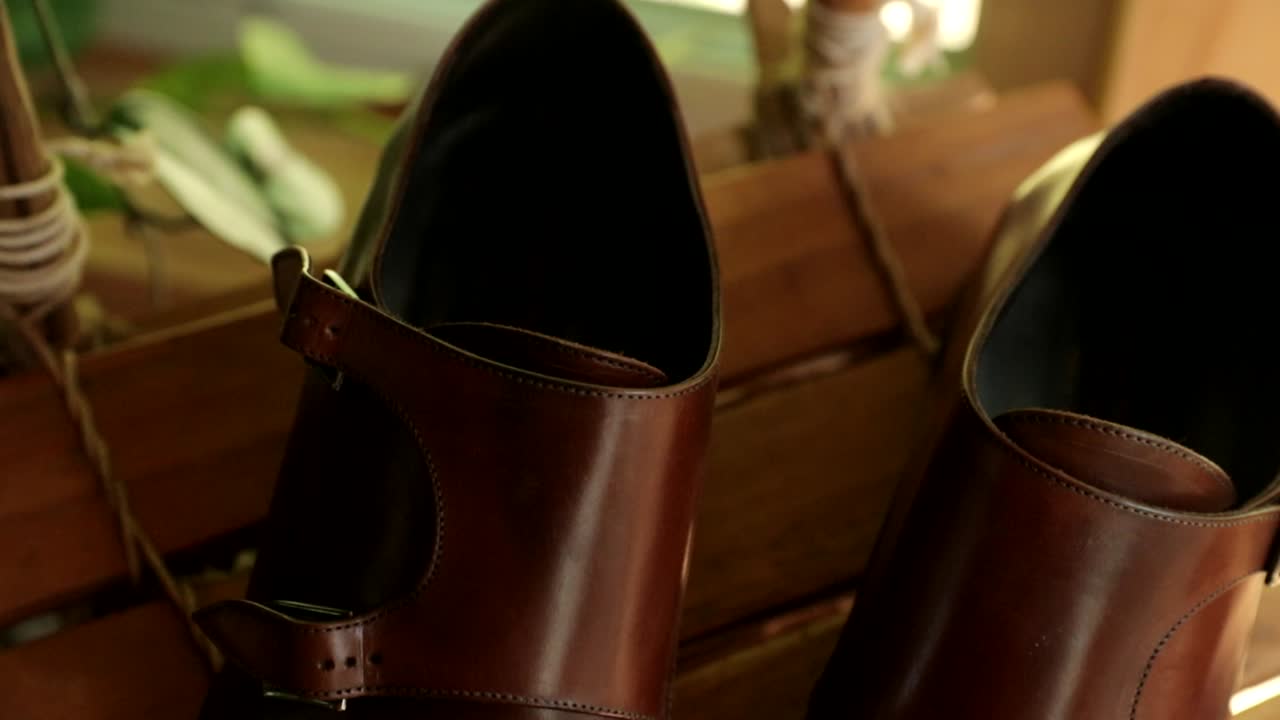 Flat lay of a grooms details before a wedding laying out in a sunny room with great lighting