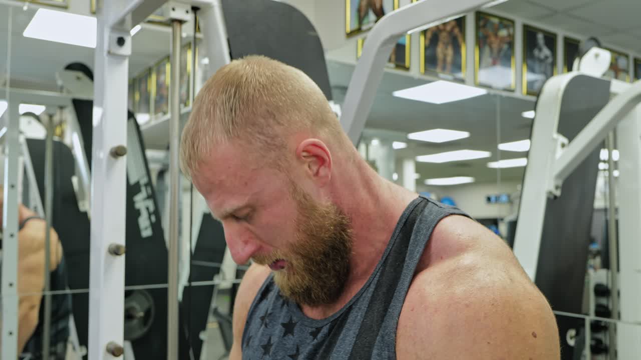 Powerful Man Exercising In Gym
