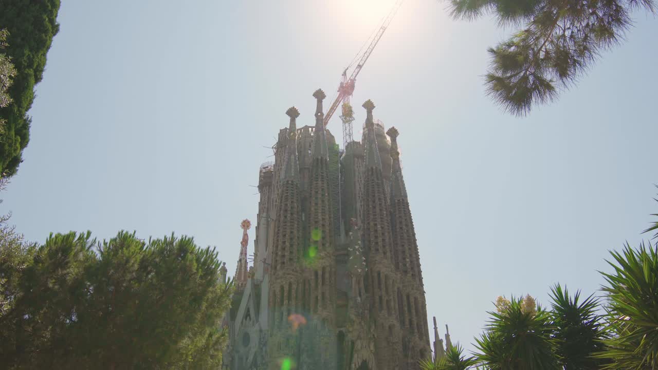 Sagrada Familia in Barcelona, Spain. Basilica, roman catholic, catalonia, summer, beautiful, blue sky, Antoni Gaudi, unesco, tourist destination / 4K Video Footage