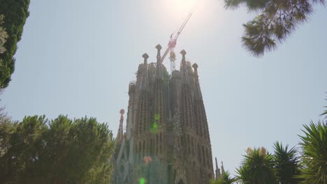 sagrada familia in barcelona, spain. basilica, roman catholic, catalonia, summer, beautiful, blue sky, antoni gaudi, unesco, tourist destination / 4k video footage