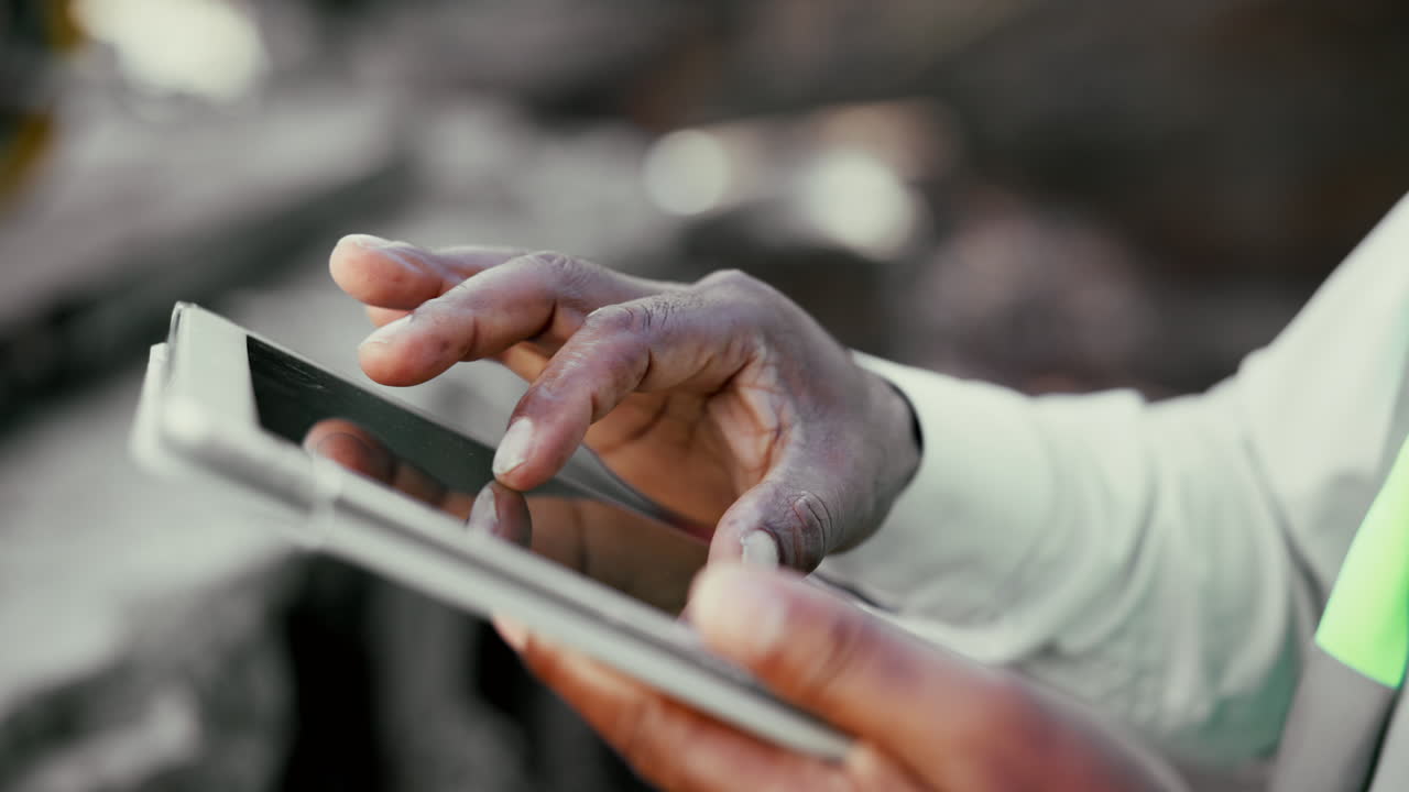 Construction worker using a tablet