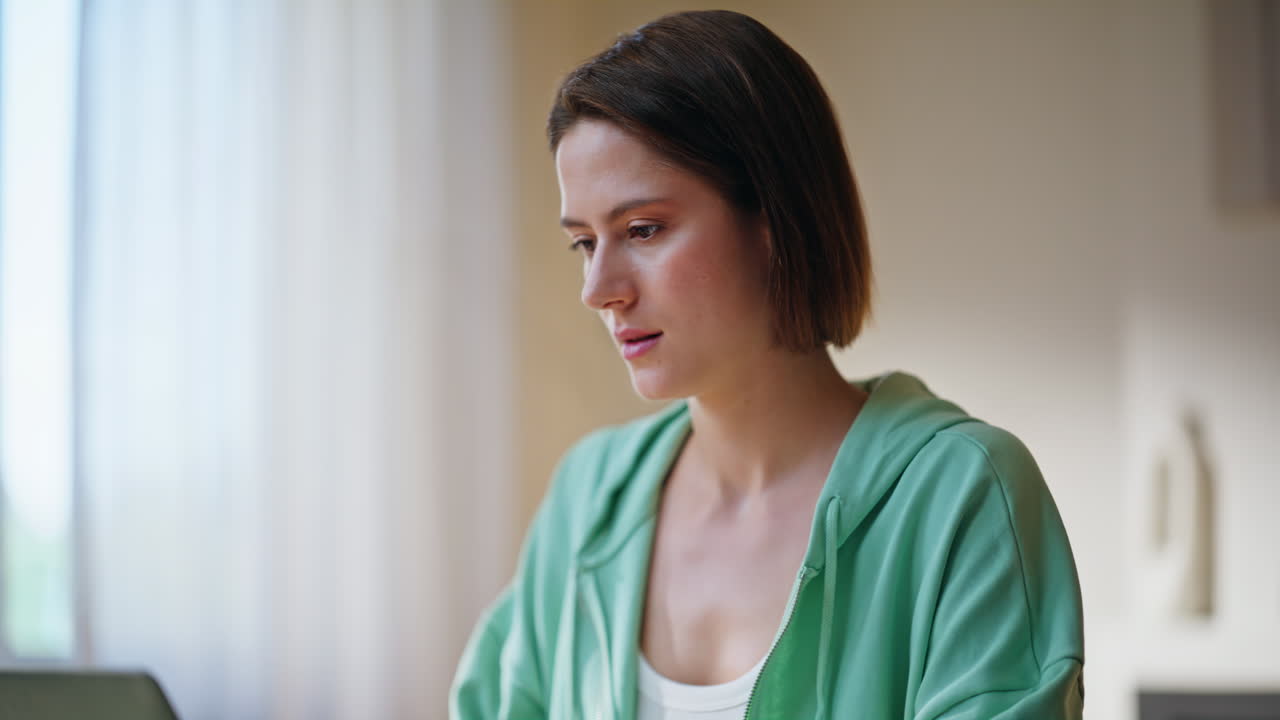 Freelancer developing online project typing laptop in apartment room closeup