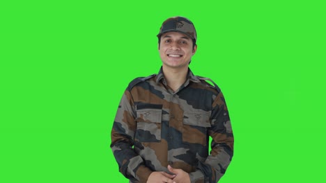 happy indian army man smiling green screen