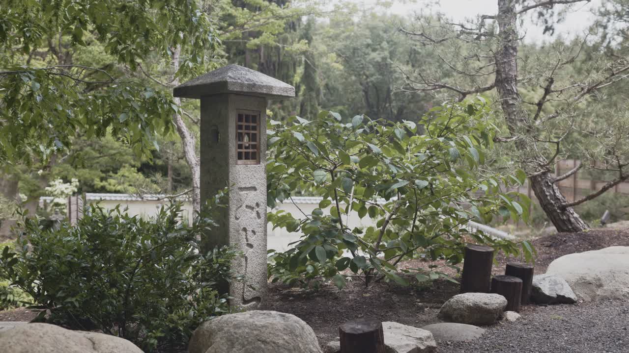 Traditional Japanese Stone Lantern Ishidoro In A Japanese Garden In Ashland, Oregon, USA. Close-up Shot
