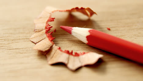 close-up of red color pencil with pencil shaving