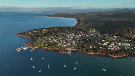 panoramic view over the coles bay peninsula and city in tasmania at sunrise. orbit shot.