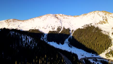 Flying-into-valley-covered-in-snow-in-the-rocky-mountains