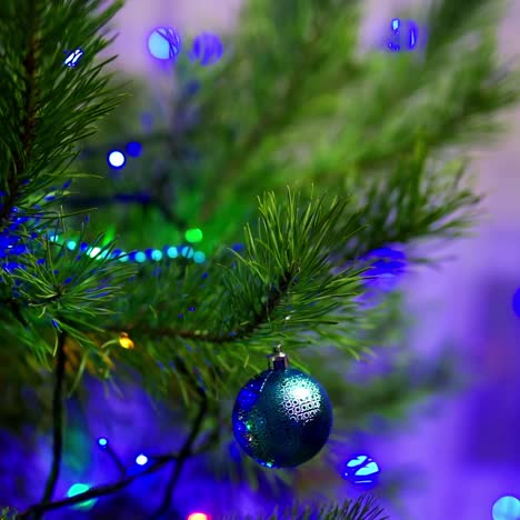 female hands decorating christmas tree