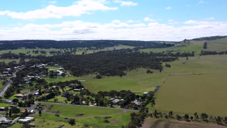 aerial revealing small australian country township with green fields