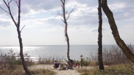 cyclist relaxing by the beach in lithuania