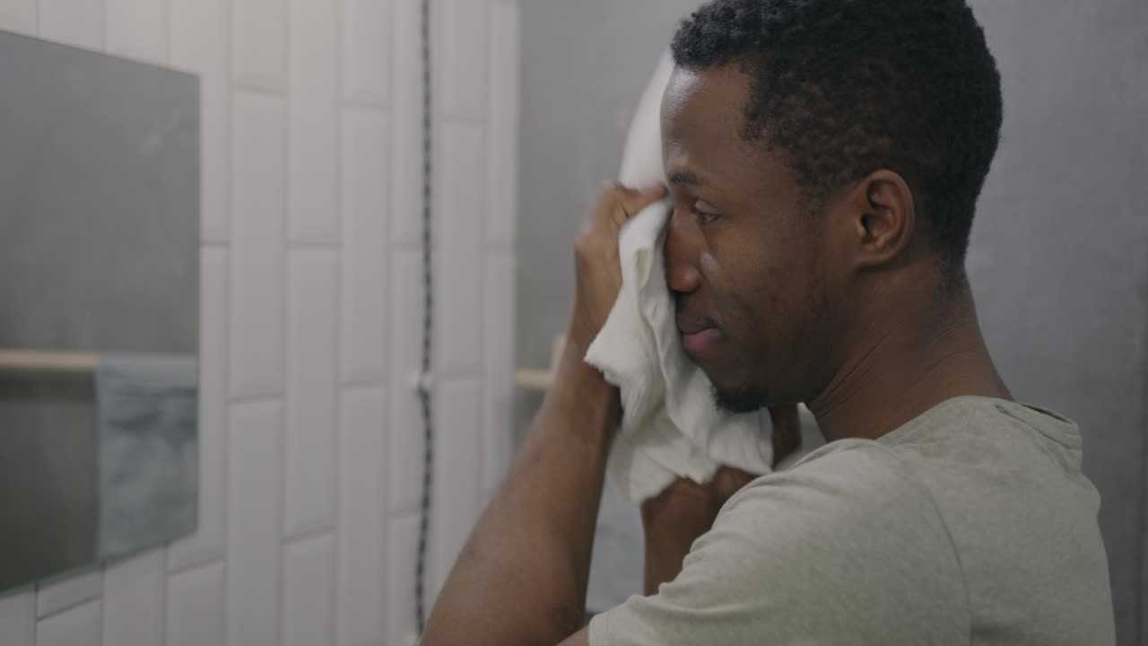 Man washing his face