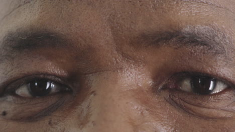 close up middle aged black man eyes looking at camera