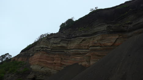 layered rock formation on a cliff face