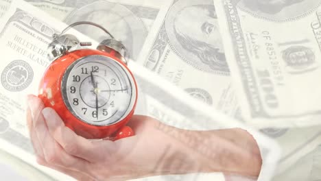 animation of hand with clock moving over banknotes