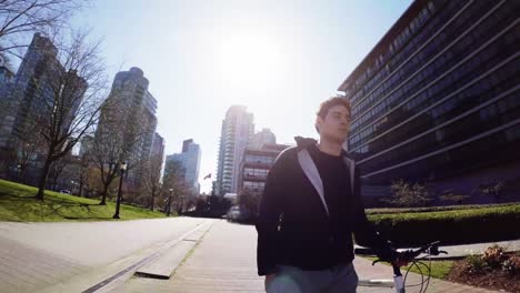 man walking with his bicycle in the city 4k